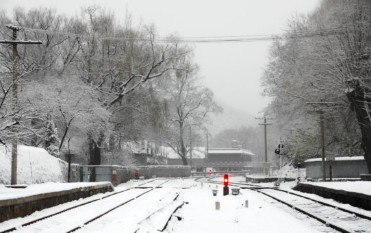 A silver-coated station in the corner of a frozen world