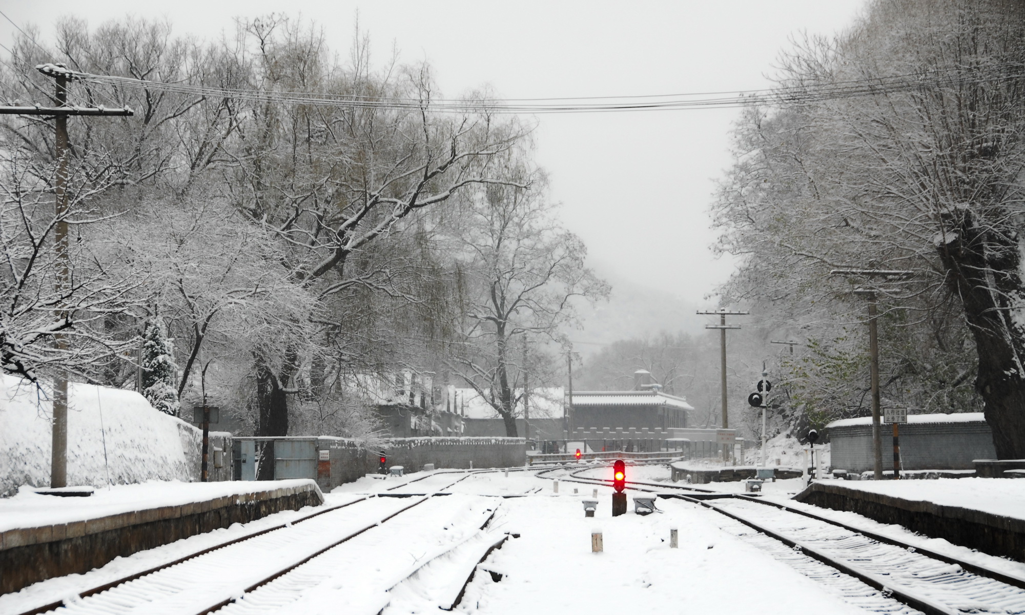 A silver-coated station in the corner of a frozen world