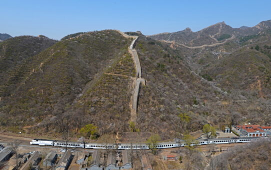 Trains winding beneath the Great Wall in Beijing