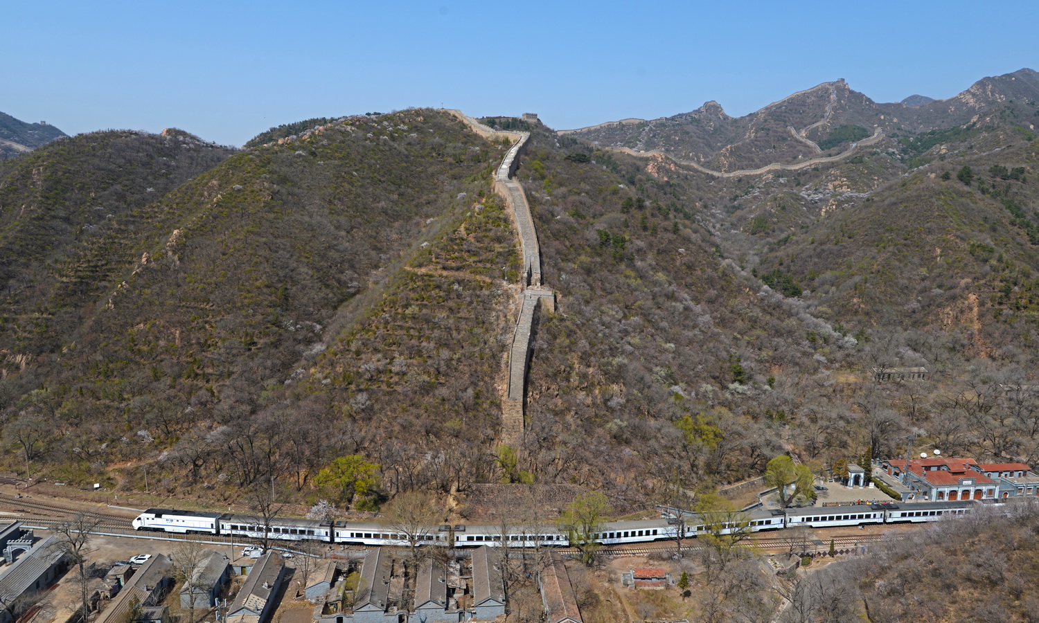 Trains winding beneath the Great Wall in Beijing